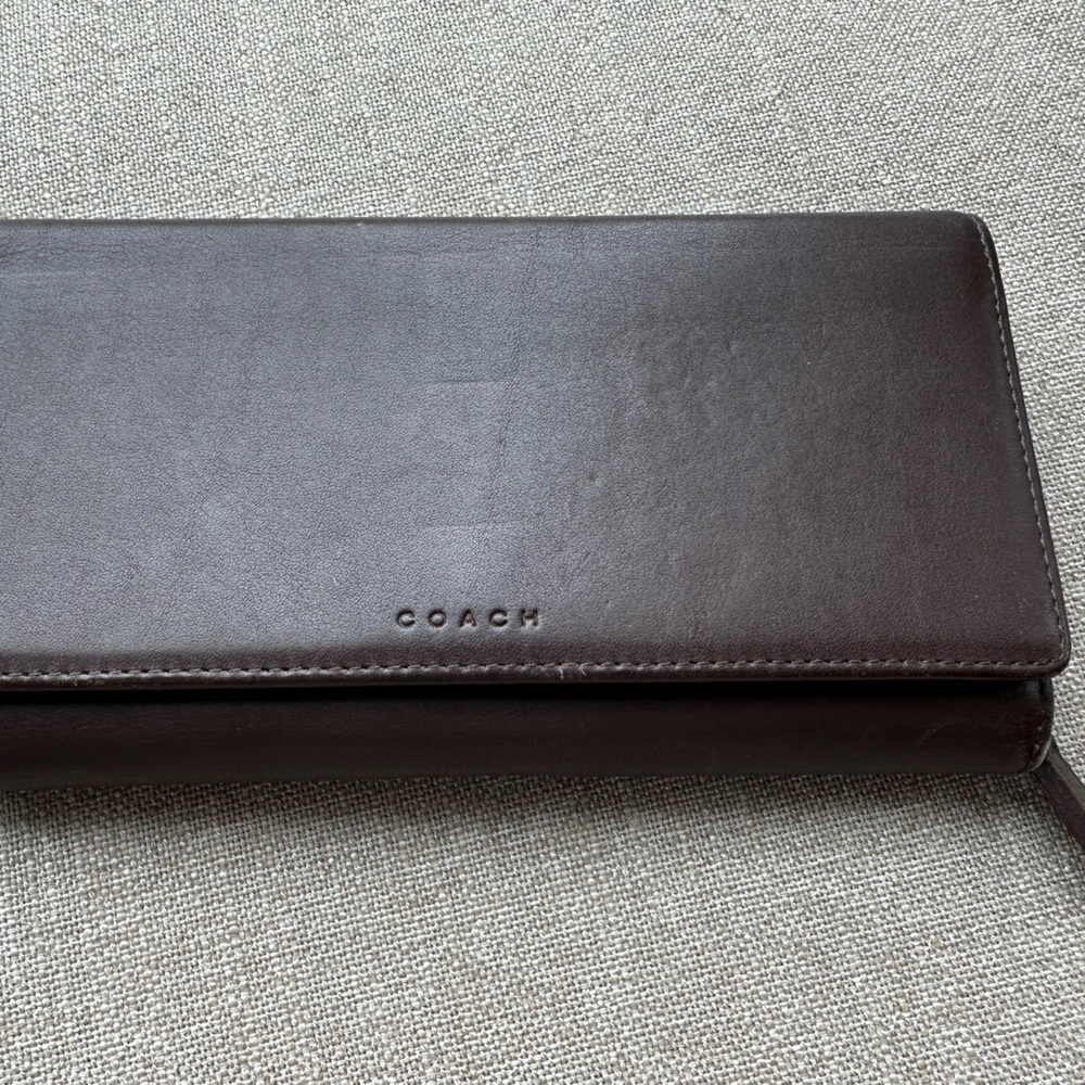 Coach tri-fold leather wallet.